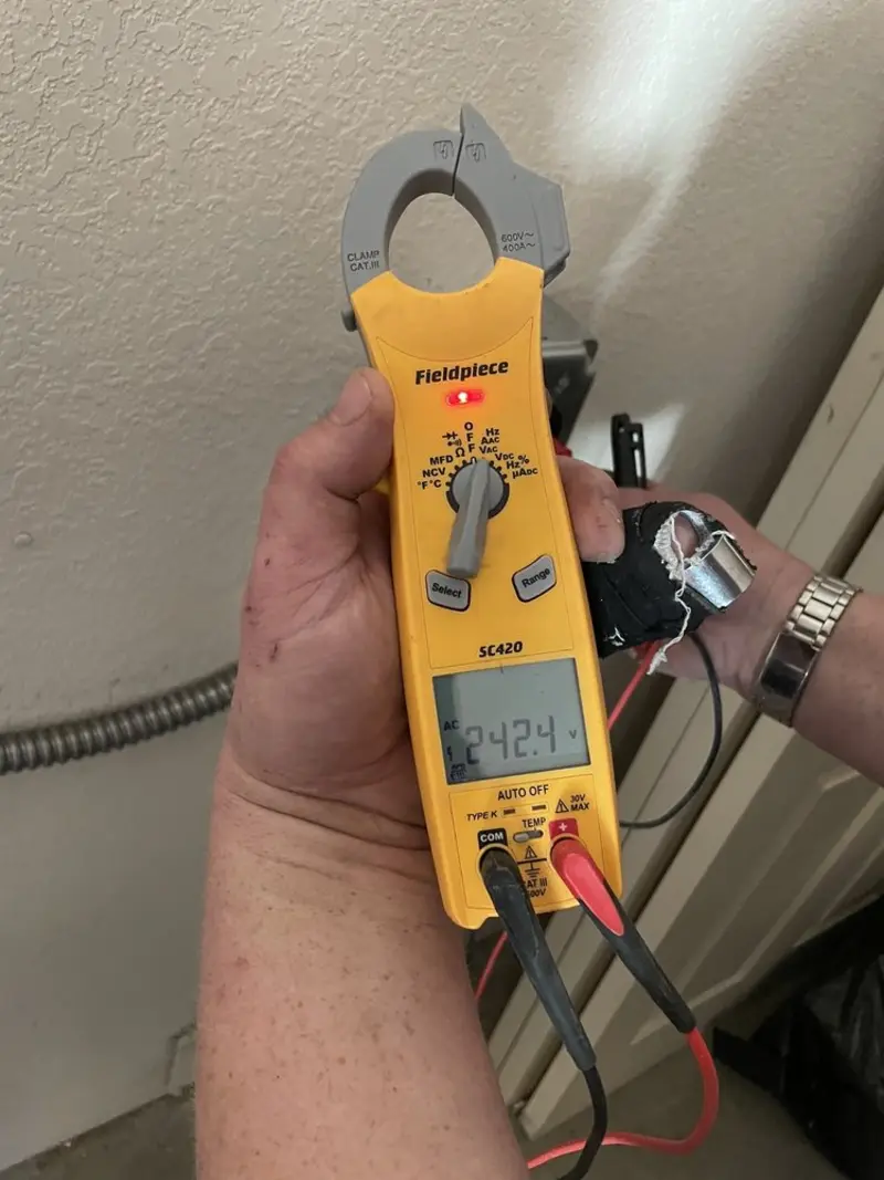Voltage testing with clamp meter during Ceiling Fan Installation in Cassville